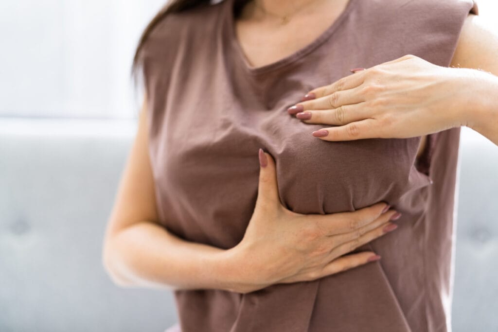 Woman performing breast massage