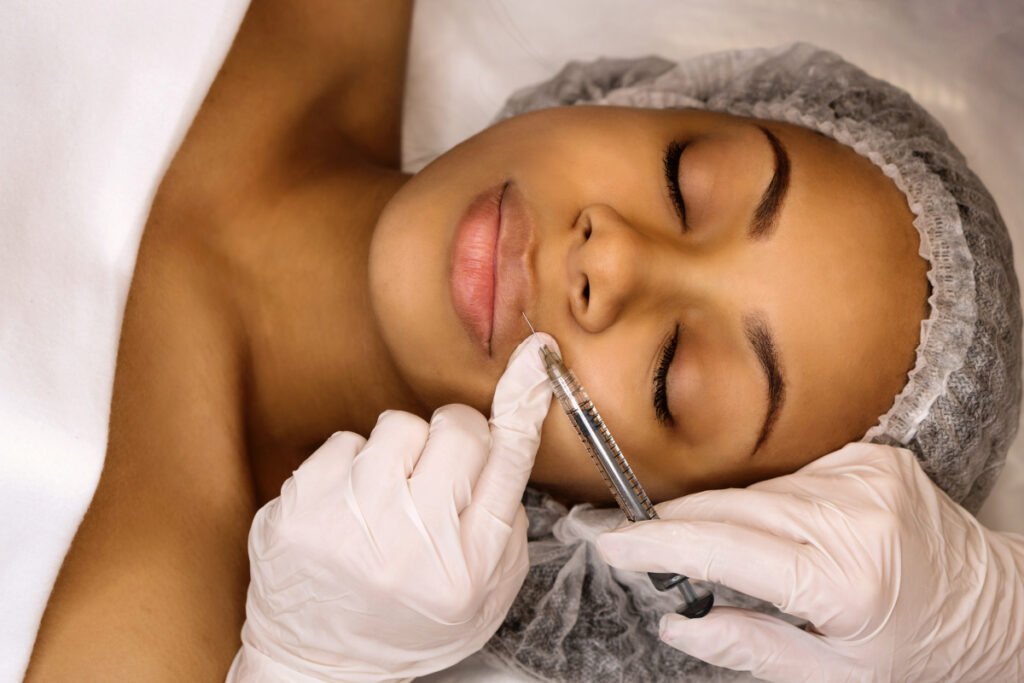 Woman getting brand name lip fillers administered by a qualified injector at a medical spa